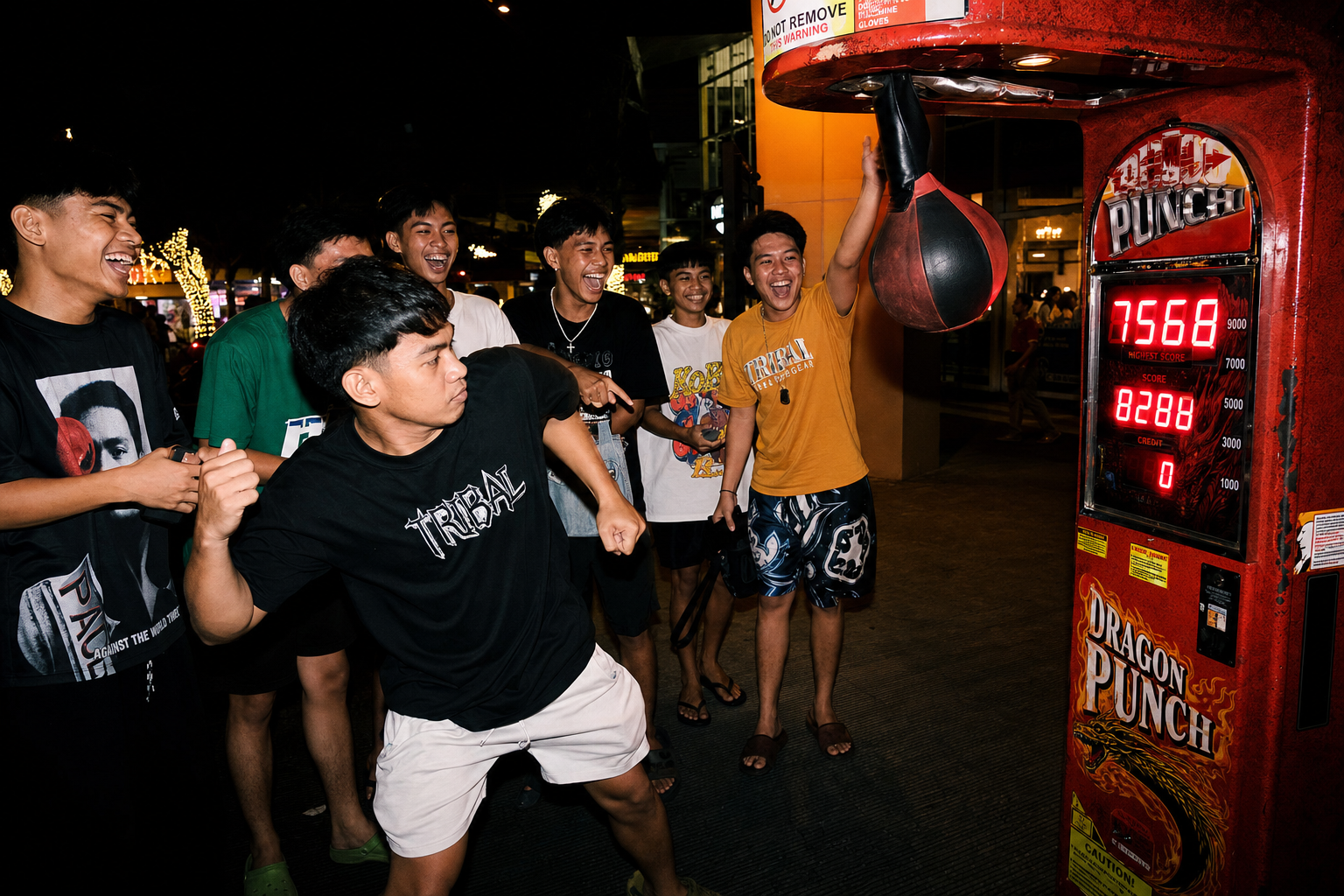 Players gathered around a Bullfight Club machine at night